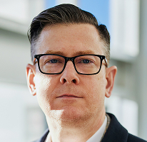 Alexandre Hughes, PDG d'une société de trading crypto, portrait.